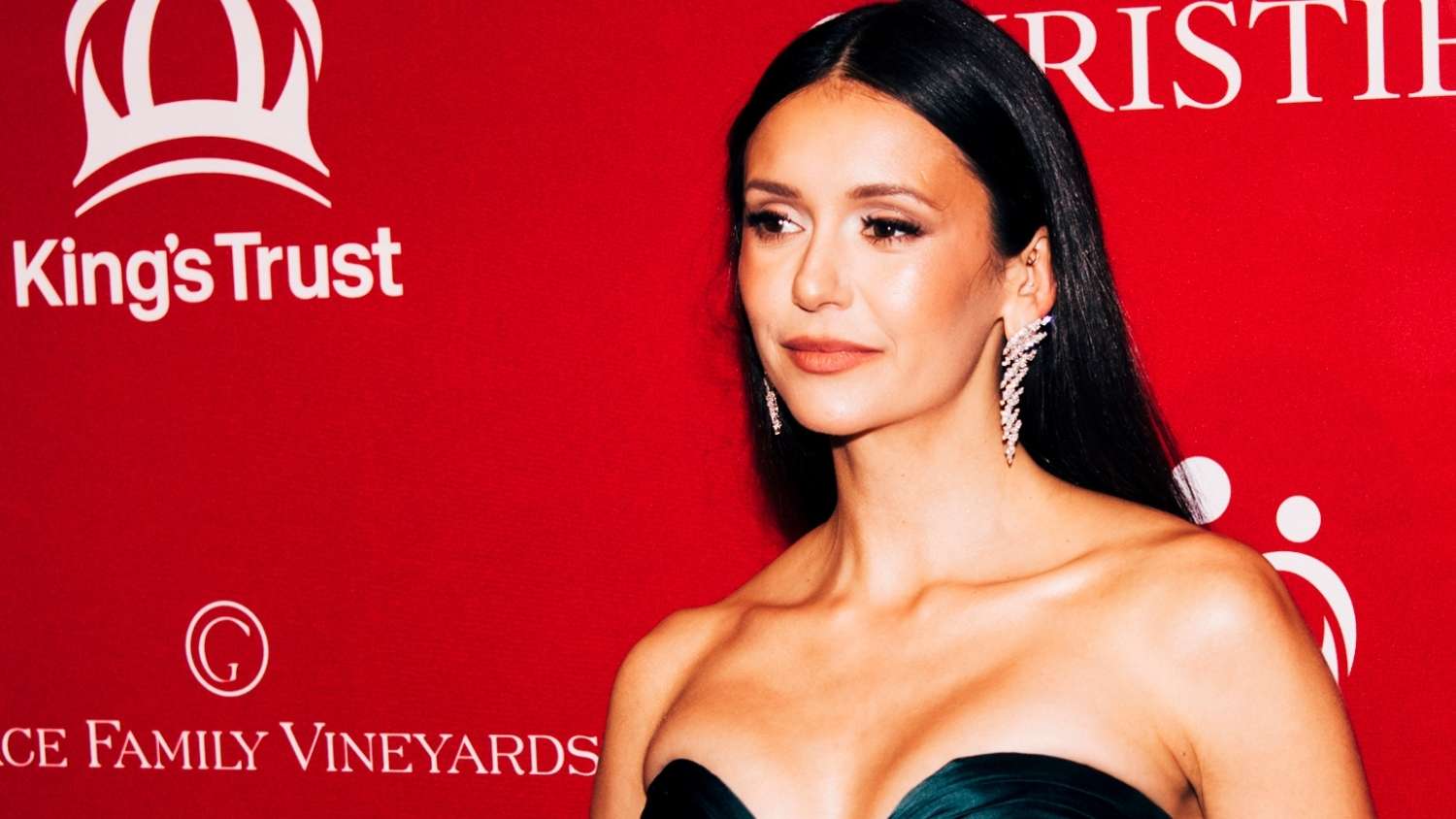 Nina Dobrev Turns Heads in Bold Plunging Dress Appearance